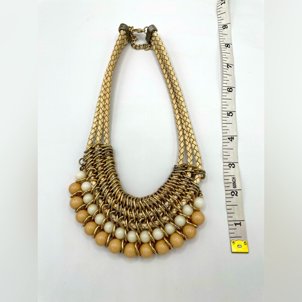 Crepe pink and pearl white rocks. Chain is pearl white with gold.